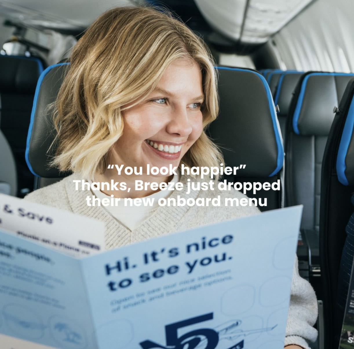 Guest reading the new Breeze onboard menu